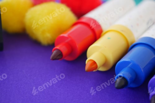 Preview: Colorful markers and craft supplies on a table