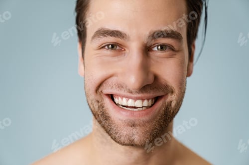 Preview: Close up of a smiling brunette shirtless man with stubble