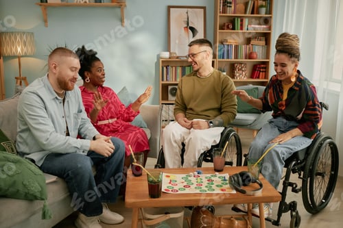 Preview: Diverse Young Adults with Disability Celebrating Birthday and Playing Board Game
