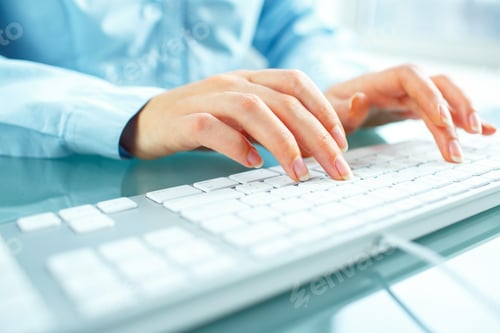Preview: Woman office worker typing on the keyboard