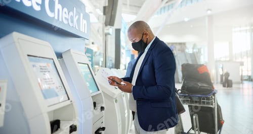 Preview: Black man, mask and checking phone in airport for corporate travel information, destination details