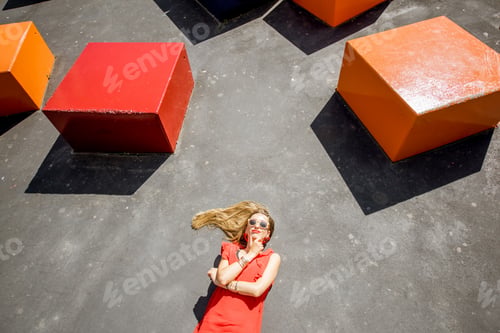 Preview: Woman lying with colorful cubes