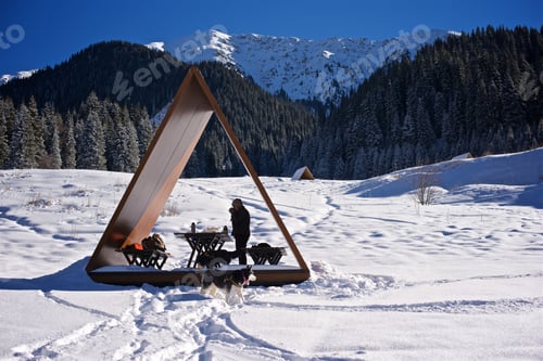 Preview: Wooden gazebo in the snowy Mountains