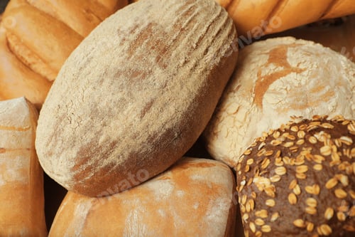 Preview: Different freshly baked breads as background, view from above