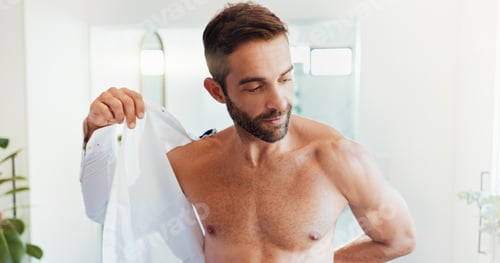Preview: Man Undressing at Home in Bright Bathroom