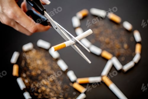 Preview: Stop smoking concept on background with broken cigarettes. Heap of cigarettes. No smoking