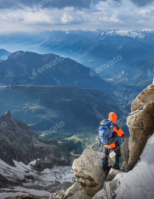 Preview: Mountain climber descending the Dent du Geant, in the Mont Blanc Massif, Courmayeur, Aosta Valley,
