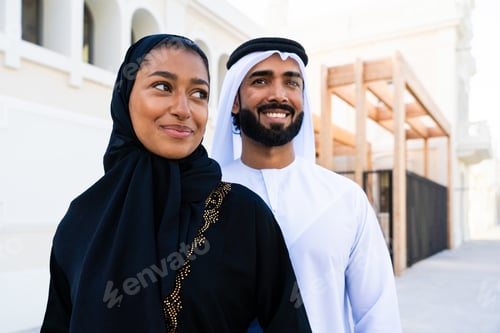 Preview: Traditional arab couple wearing emirati clothing dating outdoors