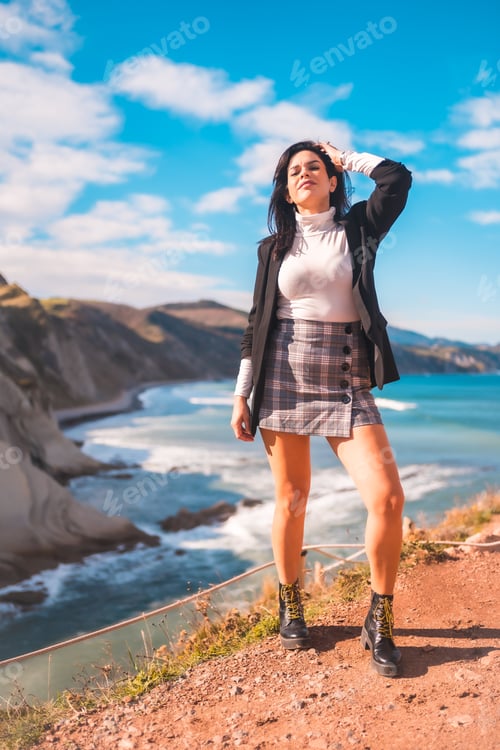 Preview: A young brunette enjoying a summer afternoon on the coast of the basque country