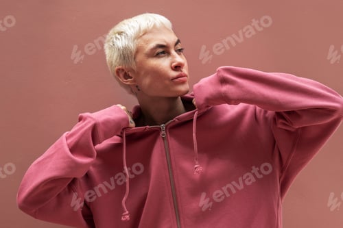 Preview: Woman wearing pink hoodie