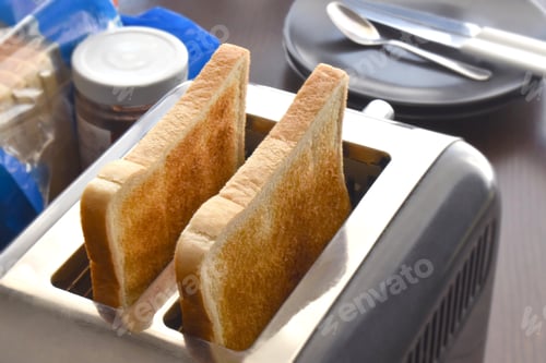 Preview: Toast in a toaster. Breakfast time at home.