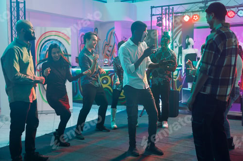 Preview: People dancing and partying in nightclub