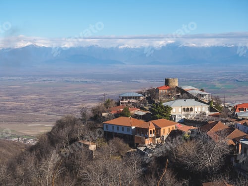 Preview: aerial view of buildings and beautiful mountains in Signagi, Georgia