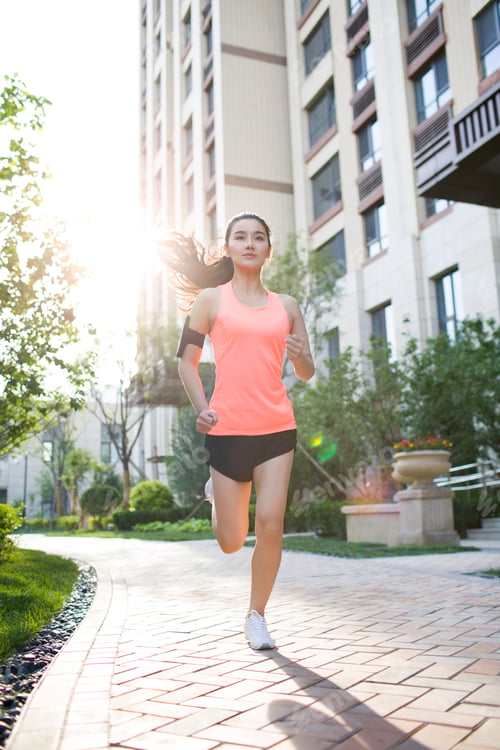 Preview: Happy young woman exercising in the morning