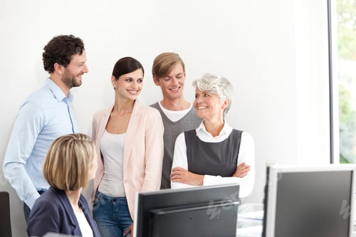 Preview: Smiling business team in office