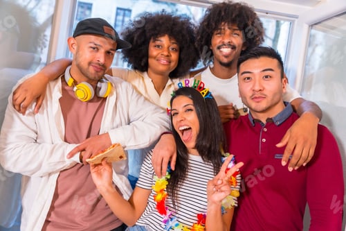 Preview: Multi-ethnic group of cheerful friends taking a souvenir selfie on the terrace at home on a birthday