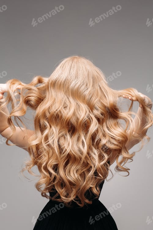 Preview: Woman Displaying Her Wavy Blonde Hair