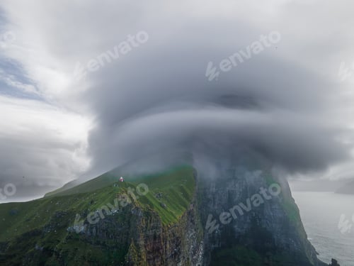 Preview: Kallur lighthouse on green hills of Kalsoy island, Faroe islands, Denmark