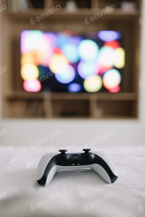 Preview: Game controller, joystick on TV screen background. Playing game console, weekend at home, leisure