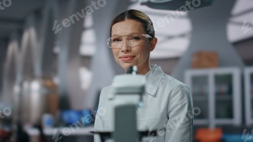 Preview: Professional biochemistry researcher looking camera in laboratory close up.