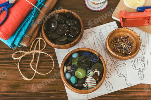 Preview: wooden bowls with buttons and pins on table