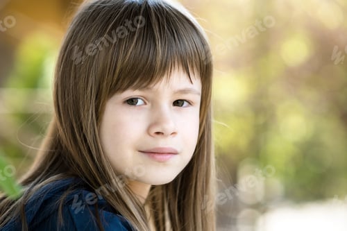 Preview: Portrait of pretty child girl with gray eyes and long fair hair outdoors