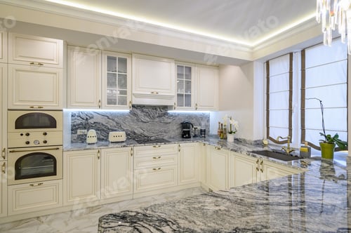 Preview: Cream colored classic kitchen with island used as dining area in studio apartment