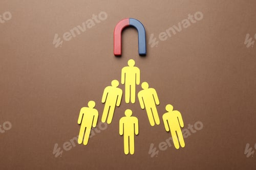 Preview: Magnet attracting paper people on color background, flat lay. Marketing concept