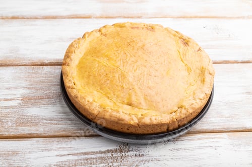 Preview: Autumn onion pie and cup of coffee on white wooden background. Side view.