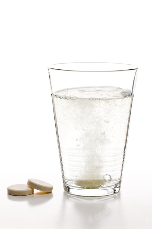 Preview: effervescent tablets and glass with water