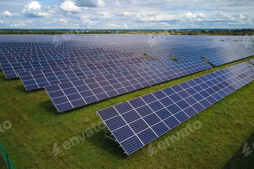 Preview: Aerial view of large sustainable electrical power plant with rows of solar photovoltaic panels