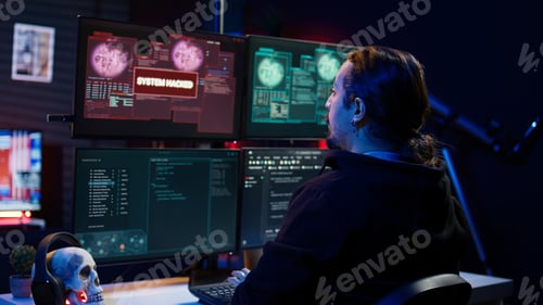 Preview: Happy hacker in apartment having burst of joy after managing to steal data