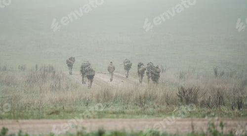 Preview: Group of soldiers with guns on a field