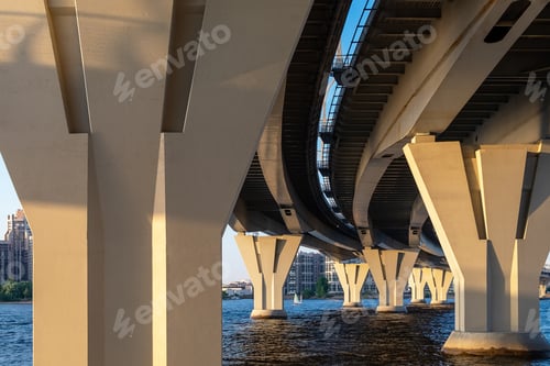 Preview: View of modern buildings and structures and automobile bridge