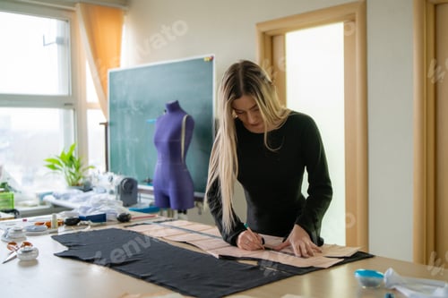 Preview: A seamstress designs a fresh clothing pattern at a bright workspace