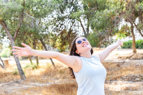 Preview: Young Middle Eastern woman relaxing in summer outdoors People freedom style.