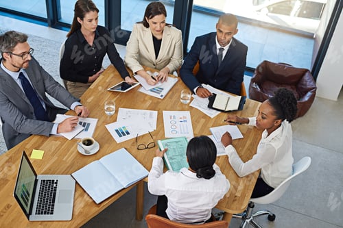 Preview: Leave it to the strategists. Cropped shot of a group of businesspeople meeting in the boardroom.