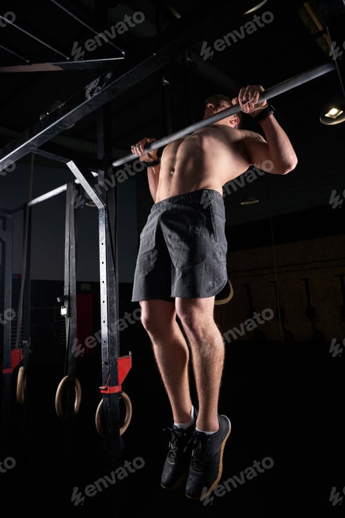 Preview: Unrecognizable sportsman doing pull ups