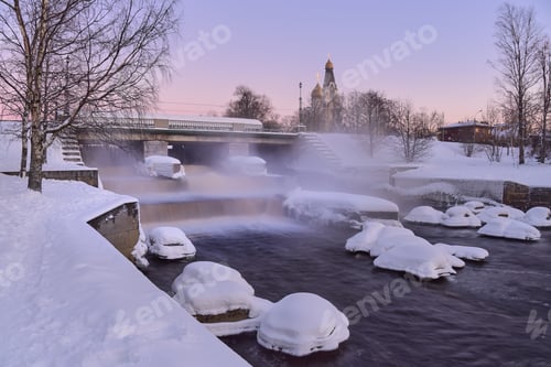 Preview: Dam and waterfall in winter and church in Russia.