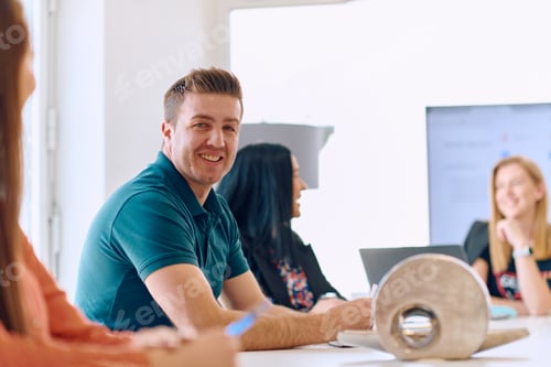 Preview: Diverse Business Team Discussing Projects in a Modern Glass Office.