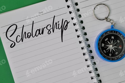 Preview: Notebook written with text SCHOLARSHIP. Education concept.