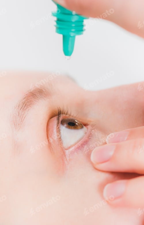 Preview: Close up of woman instilling eye drops, ophthalmology, optometry graphic
