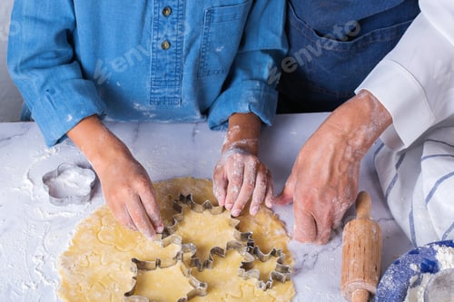 Preview: Grandmother with grandson cooking, kneading dough, baking in the kitchen