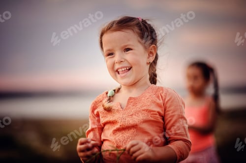 Preview: Little toddler girl in indian style clothes having fun outdoors in summer