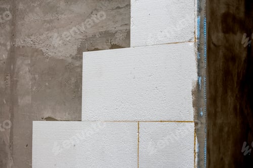 Preview: Close-up detail of plastered house wall with rigid styrofoam insulation. Modern technology