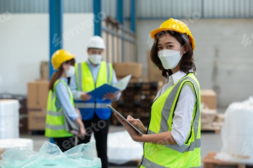Preview: Female professional worker use tablet checking stock product in warehouse logistic storage.