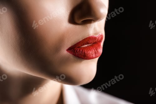 Preview: partial view of woman with red lips isolated on black
