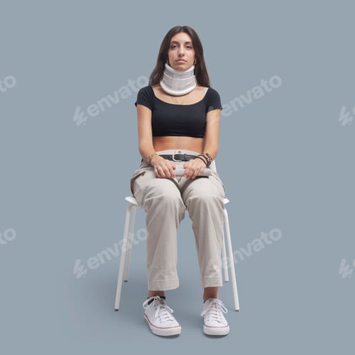 Preview: Injured patient with neck brace sitting on a chair