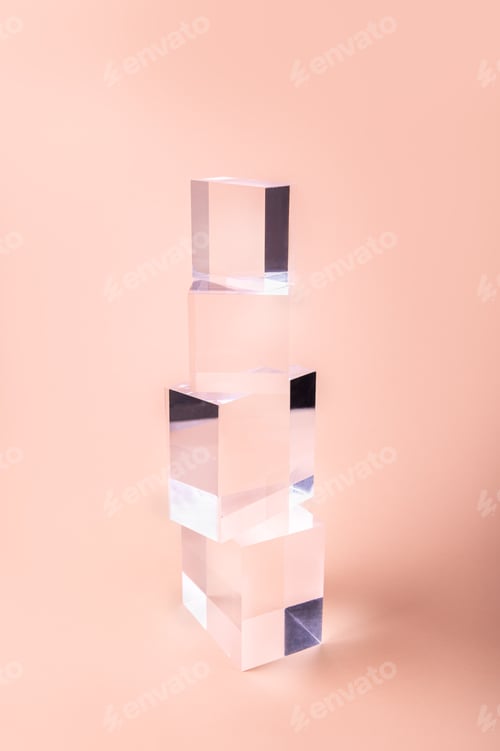 Stacked Clear Cubes on Pink Background