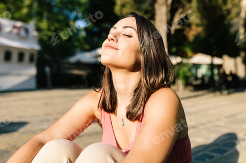 Preview: Young woman breathing deep fresh air